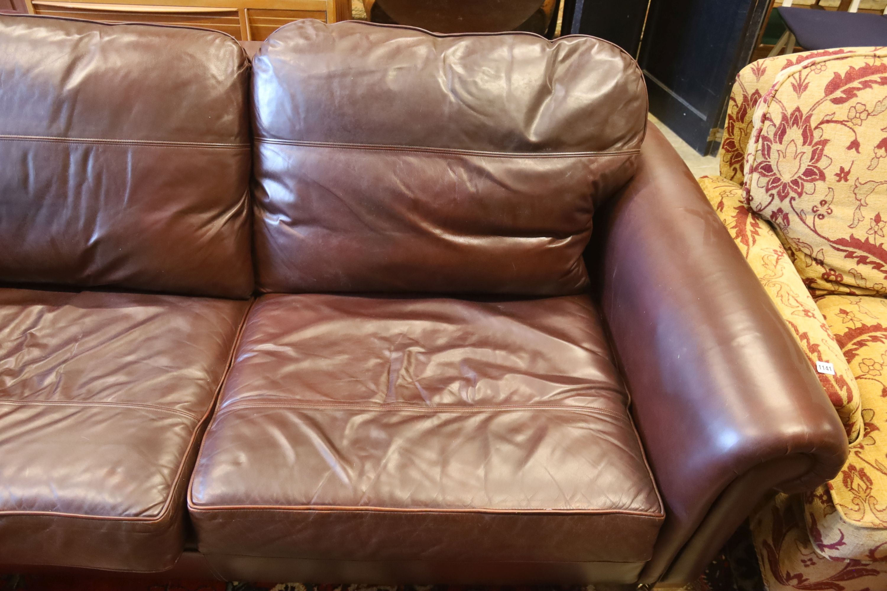 A Duresta brown leather settee and matching armchair, settee length 210cm, depth 102cm, height 90cm